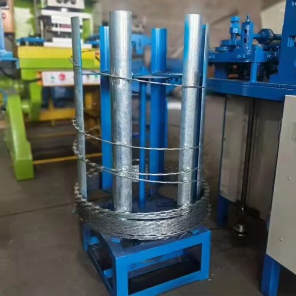 Concertina razor wire coiling machine operating in a factory
