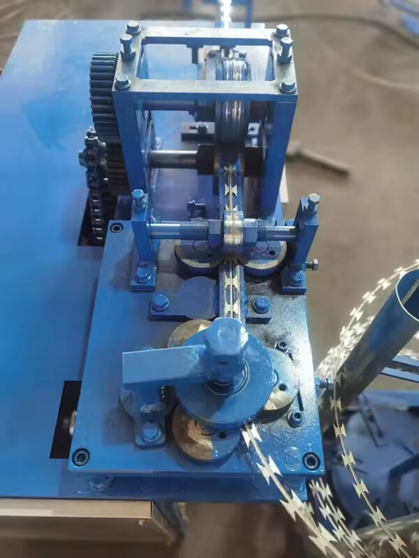 Concertina razor wire coiling machine operating in a factory