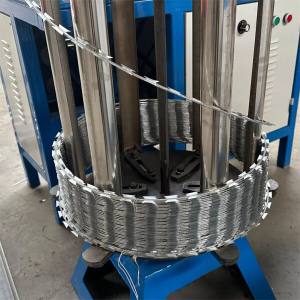 Concertina razor wire coiling machine operating in a factory